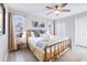 Comfortable bedroom with a ceiling fan, natural light from windows, and closet space at 5034 Pittman St, North Charleston, SC 29405