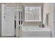 Bathroom featuring a separate shower, soaking tub, and natural light from a window at 518 Mountain Laurel Cir, Goose Creek, SC 29445