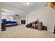 Spacious carpeted bedroom with ceiling fan, desk, and view into a second bedroom at 518 Mountain Laurel Cir, Goose Creek, SC 29445
