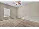 Carpeted bedroom with ceiling fan and natural light at 518 Mountain Laurel Cir, Goose Creek, SC 29445