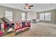 Bedroom with carpet, ceiling fan, and a bed with quilt next to a side table with a remote control at 518 Mountain Laurel Cir, Goose Creek, SC 29445