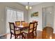 Dining room featuring wood table, six chairs and large sliding glass doors at 518 Mountain Laurel Cir, Goose Creek, SC 29445