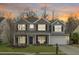 Charming two-story home with a well-manicured lawn and attached two-car garage at 518 Mountain Laurel Cir, Goose Creek, SC 29445