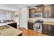 Well-equipped kitchen with dark cabinets, granite countertops, and stainless steel appliances at 518 Mountain Laurel Cir, Goose Creek, SC 29445