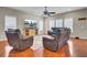 Bright living room featuring hardwood floors, large windows, and comfortable seating at 518 Mountain Laurel Cir, Goose Creek, SC 29445