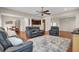 Spacious living room with hardwood floors and view to adjacent dining room and kitchen at 518 Mountain Laurel Cir, Goose Creek, SC 29445