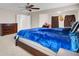 Spacious main bedroom with ceiling fan, dresser, and doors leading to ensuite at 518 Mountain Laurel Cir, Goose Creek, SC 29445