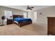 Main bedroom featuring ceiling fan, two windows, and ensuite bathroom entrance at 518 Mountain Laurel Cir, Goose Creek, SC 29445