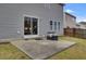 Concrete patio outside of a house with a sliding glass door, grill, and a fenced-in yard at 518 Mountain Laurel Cir, Goose Creek, SC 29445