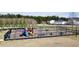 Community playground with colorful play structures, swings, picnic tables and safe fencing for to enjoy at 518 Mountain Laurel Cir, Goose Creek, SC 29445