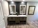 Bathroom with double sinks and modern accents at 5355 Old Military Rd, Adams Run, SC 29426