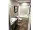 Bathroom featuring a single sink vanity and framed shower with a curtain at 5355 Old Military Rd, Adams Run, SC 29426
