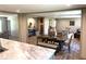 Dining and living spaces include table seating for six, a large window, and contemporary decor at 5355 Old Military Rd, Adams Run, SC 29426