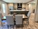 Bright kitchen featuring stainless steel appliances, a large island with seating, and modern cabinetry at 5355 Old Military Rd, Adams Run, SC 29426