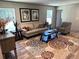 Cozy living room with a comfortable sofa, patterned rug, and bright natural light at 5355 Old Military Rd, Adams Run, SC 29426