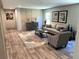 Inviting living room showcasing modern décor, wood-look flooring, and comfortable seating at 5355 Old Military Rd, Adams Run, SC 29426