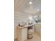 Basement washroom boasting a vessel sink, natural light, and shiplap walls, creating a stylish and inviting space at 54 Gibbes St, Charleston, SC 29401