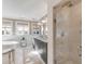 Bright bathroom featuring a soaking tub, double vanity, and a glass walk-in shower at 54 Gibbes St, Charleston, SC 29401