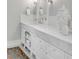 Bathroom vanity with marble countertop and drawer and open-shelf storage at 54 Gibbes St, Charleston, SC 29401