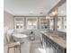 Bright bathroom featuring a soaking tub, double vanity, and natural light from three windows at 54 Gibbes St, Charleston, SC 29401