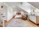 Bedroom featuring vaulted ceilings, hardwood floors, and a decorative chandelier at 54 Gibbes St, Charleston, SC 29401