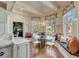Bright breakfast nook featuring banquette seating and large windows at 54 Gibbes St, Charleston, SC 29401