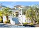 Stunning white brick house with a grand entrance and a picturesque, turret-style covered porch perfect for relaxation at 54 Gibbes St, Charleston, SC 29401