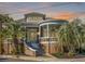 Stunning brick house with a grand entrance and a picturesque, turret-style covered porch perfect for relaxation at 54 Gibbes St, Charleston, SC 29401