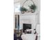 Close-up of a decorative fireplace with an ornate mantle and stylish accessories at 54 Gibbes St, Charleston, SC 29401