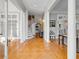 Spacious foyer with elegant herringbone floors, grand columns, and a graceful staircase, creating a sophisticated entrance at 54 Gibbes St, Charleston, SC 29401