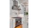 Gourmet kitchen featuring a chef-grade stove, custom cabinets, and marble countertops at 54 Gibbes St, Charleston, SC 29401