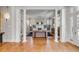 Spacious living room with hardwood floors, grand columns, and a cozy fireplace for elegant entertaining at 54 Gibbes St, Charleston, SC 29401