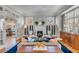 Elegant living room featuring a fireplace, hardwood floors, and sophisticated decor at 54 Gibbes St, Charleston, SC 29401