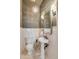 Stylish powder room featuring a pedestal sink and chandelier at 54 Gibbes St, Charleston, SC 29401