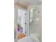 A modern glass shower unit with white tiling, viewed from the bedroom, creating an open and connected space at 54 Gibbes St, Charleston, SC 29401
