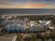Beautiful aerial view of the resort, showcasing beach access, and community pool, all set against a stunning sunset backdrop at 5802 Palmetto Dr # B-202, Isle of Palms, SC 29451