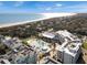 Stunning aerial view showcases a resort with a beach, pool, and many community ammenities at 5802 Palmetto Dr # B-202, Isle of Palms, SC 29451