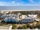 Stunning aerial view of beachfront community, showcasing ocean views and beautiful architecture at 5802 Palmetto Dr # B-202, Isle of Palms, SC 29451