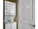 Conveniently located white stackable washer and dryer unit inside the property at 5802 Palmetto Dr # B-202, Isle of Palms, SC 29451