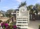 Resort photo op on a sunny day in this oversized custom beach chair at 5802 Palmetto Dr # B-202, Isle of Palms, SC 29451
