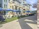 Charming street view with shops, cafe, and common space in this beautifully kept resort at 5802 Palmetto Dr # B-202, Isle of Palms, SC 29451