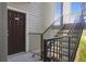 Exterior landing and stairs of a condo building with unit 14206 door at 700 Daniel Ellis Dr # 14206, Charleston, SC 29412