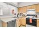 Well-lit kitchen with stainless steel dishwasher and ample counter space at 700 Daniel Ellis Dr # 14206, Charleston, SC 29412