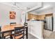 Cozy dining area adjacent to a kitchen equipped with stainless steel appliances at 700 Daniel Ellis Dr # 14206, Charleston, SC 29412