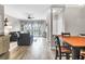 Bright living room with large window, ceiling fan, and view into the dining area at 700 Daniel Ellis Dr # 14206, Charleston, SC 29412
