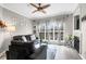 Bright living room featuring a ceiling fan, large windows, and comfortable seating at 700 Daniel Ellis Dr # 14206, Charleston, SC 29412
