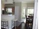 Open concept view of kitchen with breakfast bar and dining area featuring natural light at 700 Daniel Ellis Dr # 6107, Charleston, SC 29412