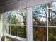 Bright windows show outside trees, highlighting the natural light in the home at 700 Daniel Ellis Dr # 6107, Charleston, SC 29412