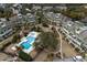 Aerial view of the condo community showcasing pools, landscaping, and residential buildings at 7000 Palmetto Dr # 5A, Isle of Palms, SC 29451
