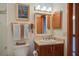 Well-lit bathroom with a vanity, mirror, and a shower and bath combination with tile accents at 7000 Palmetto Dr # 5A, Isle of Palms, SC 29451